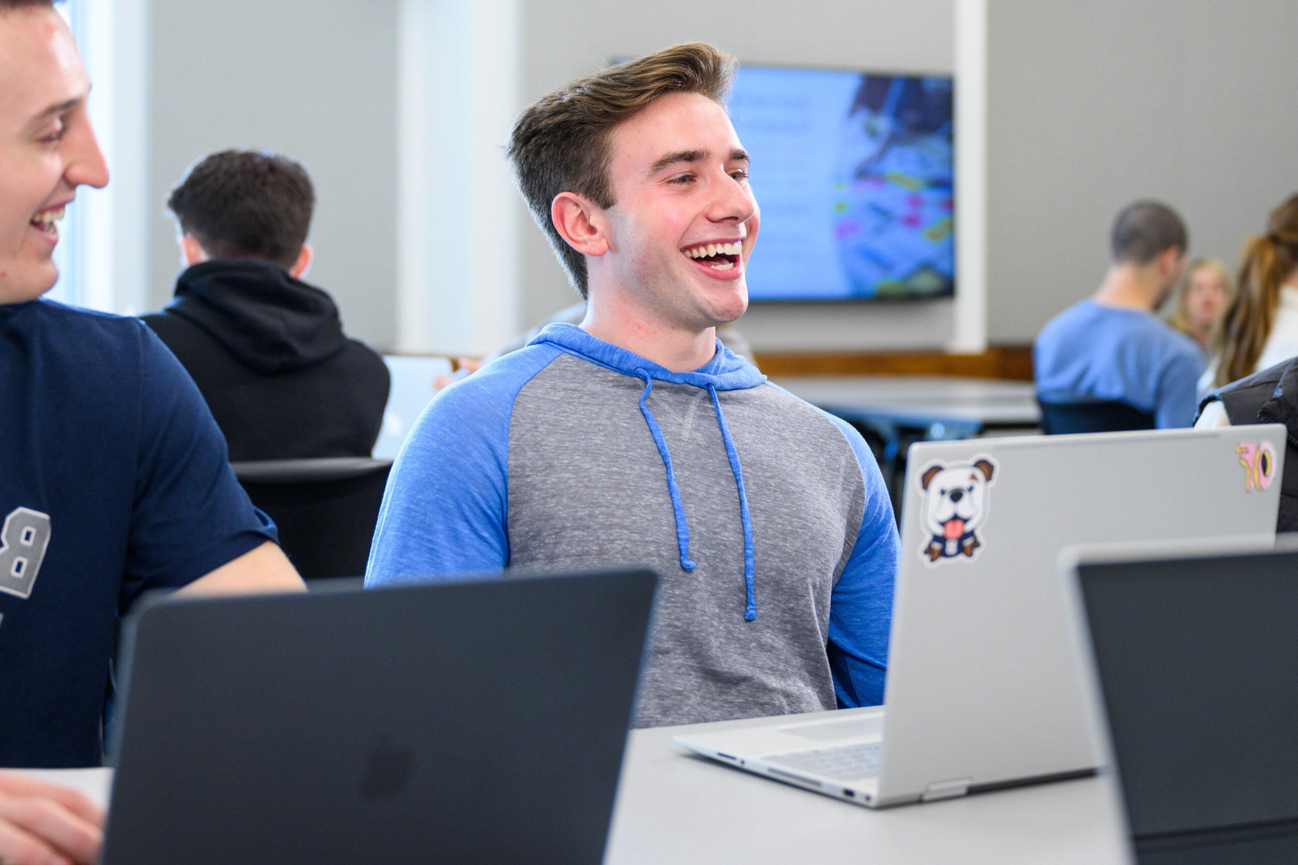 Male Butler student smiling during class.